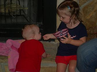 Brooklinn Cook Feeding Madalinn Blueberries on July 4, 2010